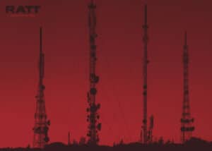 Array of advanced antenna towers silhouetted against dusk sky, symbolizing robust radio transmission technology.