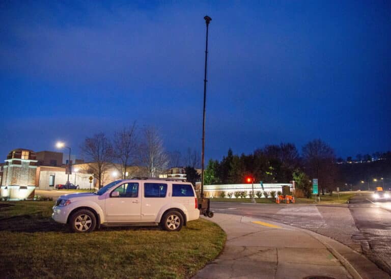 The RATT surveillance tower extended and monitoring a high-traffic area outside the arena at night