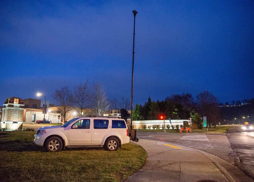 The RATT surveillance tower extended and monitoring a high-traffic area outside the arena at night