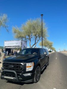 Tempe Police Department’s RATT mobile monitoring tower deployed on a black pickup truck near the entrance of the 2025 WM Phoenix Open.