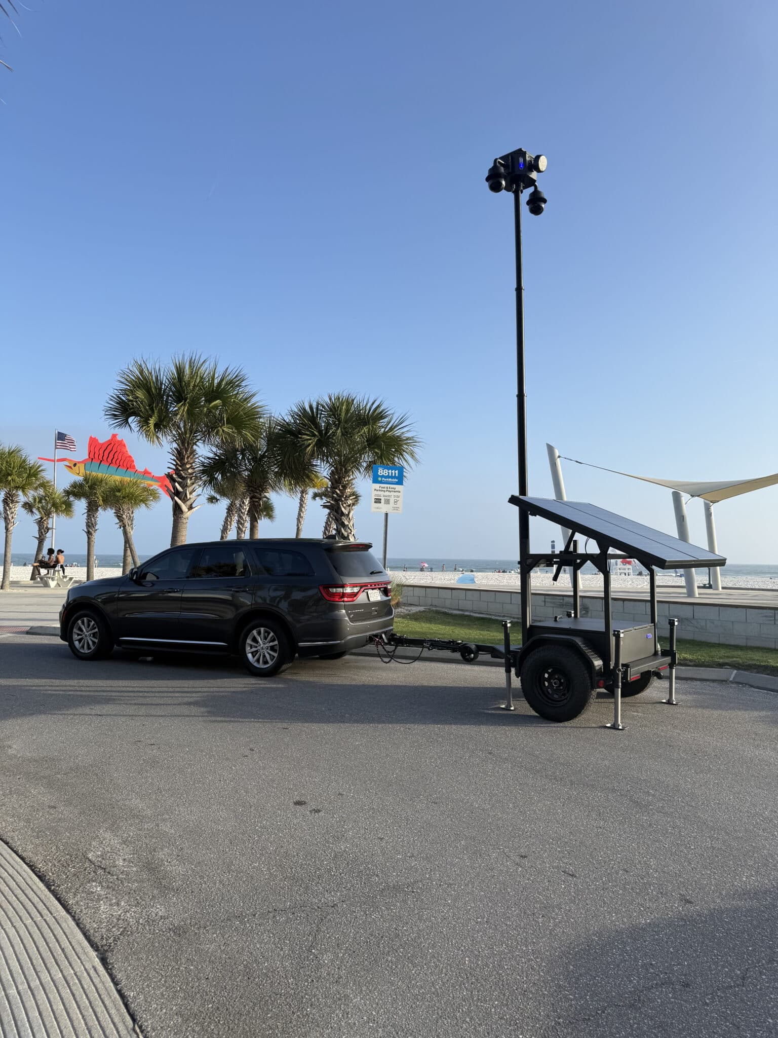 Gulf Shores Police Department Dodge Durango with CTS FXT-44 autonomous solar surveillance trailer deployed