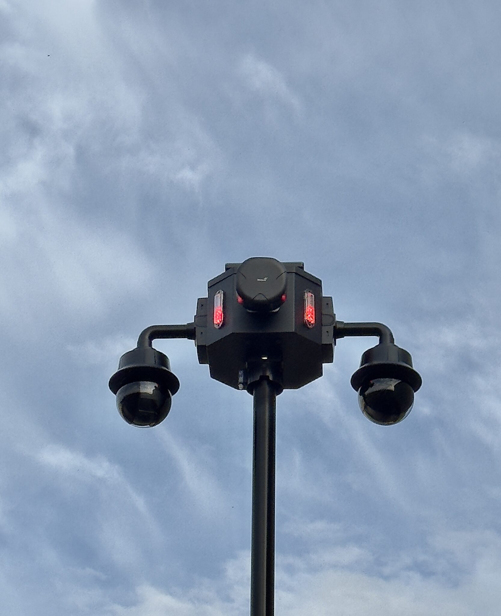 Dual PTZ pole camera with integrated networking and emergency strobes mounted on the mast of a CriticalTS FXT-44 solar surveillance trailer deployed by Gulf Shores Police Department