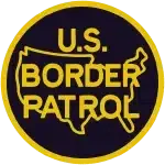 U.S. Border Patrol circular patch logo in black and gold.